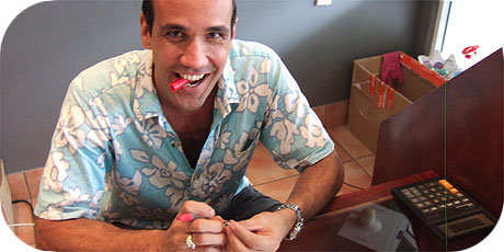 Shop owner Teanaroa Papa Worthington at work in his black pearl shop