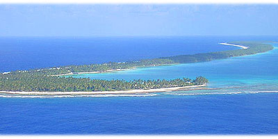 >>> Aerial showing the curved island Manihiki &copy; Halina Sydow